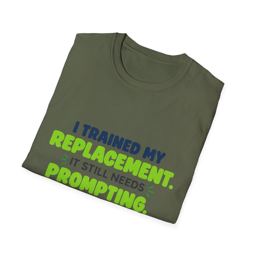 Military Green T-shirt featuring "I trained my replacement. It still needs prompting." AIronic design, folded detail view