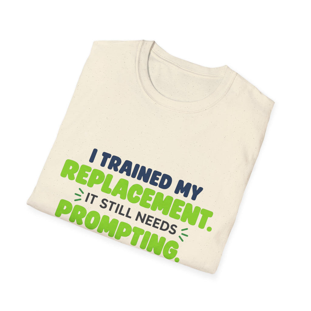 Natural T-shirt featuring "I trained my replacement. It still needs prompting." AIronic design, folded detail view