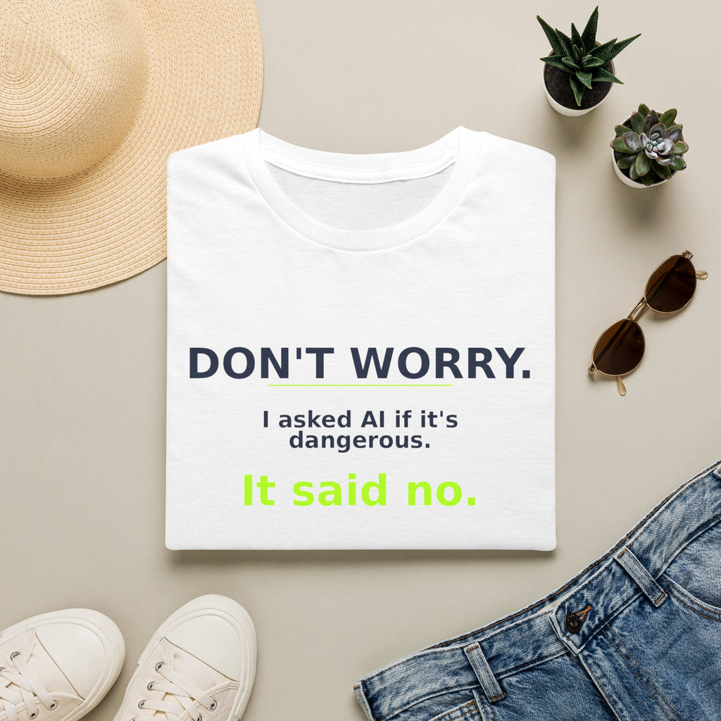 Folded White T-shirt showing "Don't worry. AI said no." AI humor design by AIronic