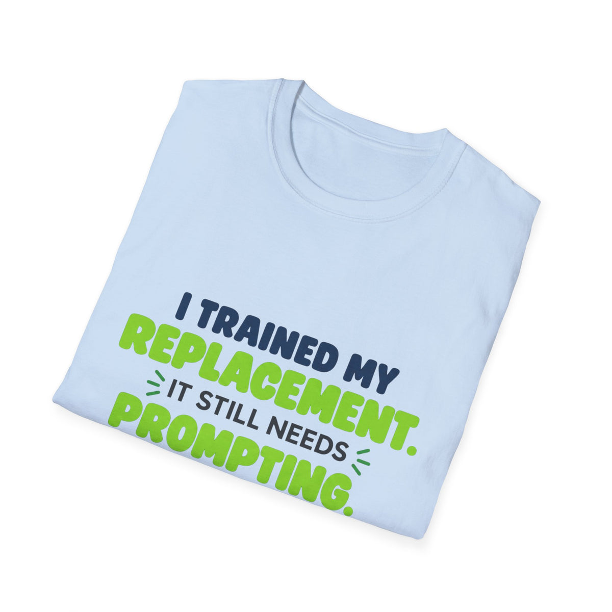 Light Blue T-shirt featuring "I trained my replacement. It still needs prompting." AIronic design, folded detail view