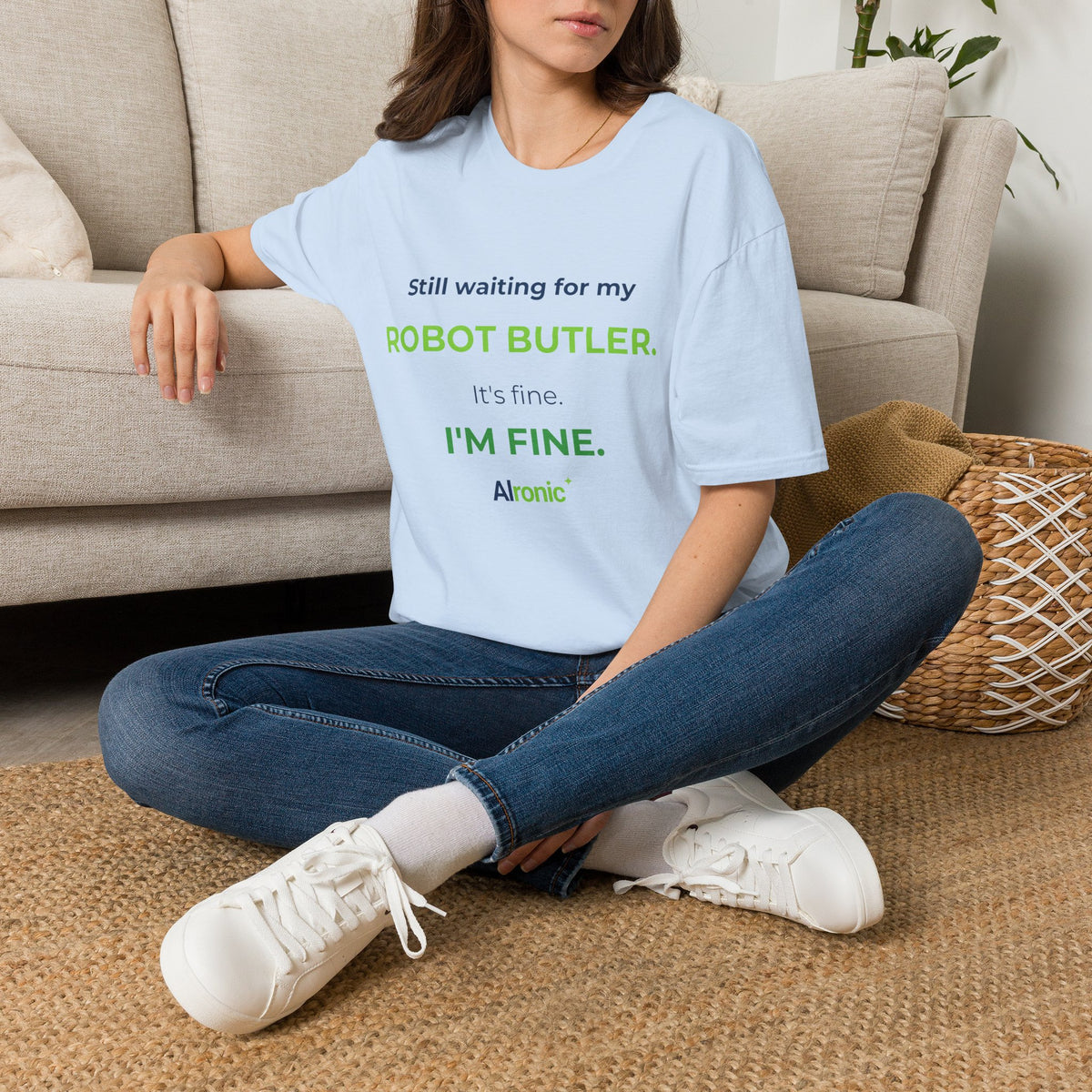 Light Blue T-shirt featuring “Still waiting for my robot butler” AI humor design by AIronic, catalog view 1
