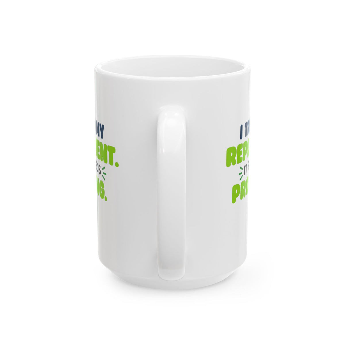 White ceramic mug featuring "I trained my replacement. It still needs prompting." AIronic design, opposite handle view