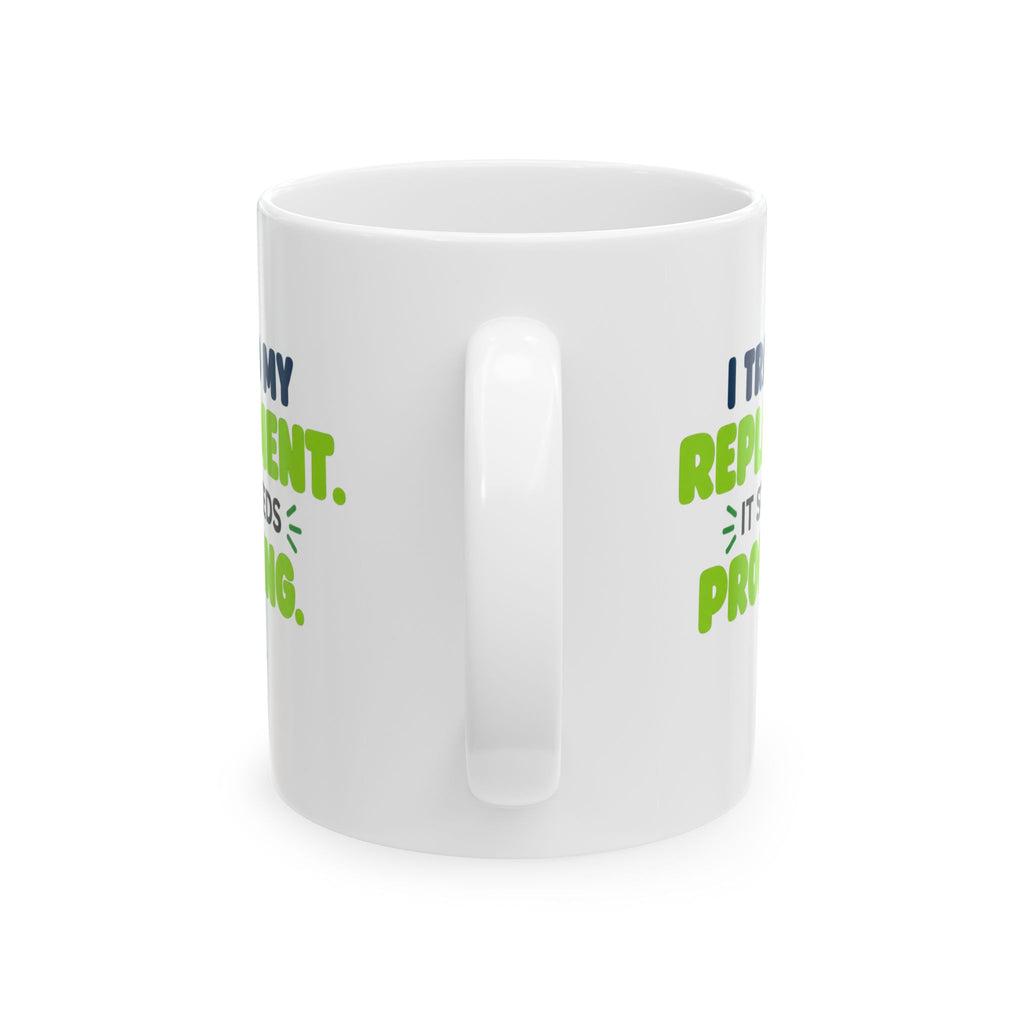 White ceramic mug featuring "I trained my replacement. It still needs prompting." AIronic design, rear handle view
